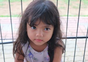 Picture of a young girl looking at the camera